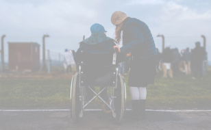 woman assisting disabled person