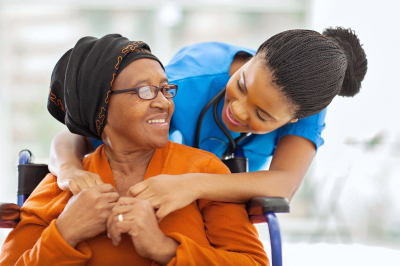 Happy senior patient with friendly female nurse